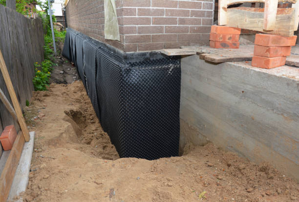 Happy homeowners after waterproofing job in Big Bend